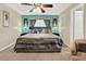 Comfortable main bedroom with a ceiling fan, ensuite bathroom access, and calming decor at 5545 Devonbriar Way # 206, Orlando, FL 32822