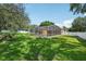 Expansive backyard with screened-in pool and lush green lawn at 604 Cheviot Ct, Apopka, FL 32712