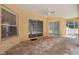 Spacious covered patio with brick flooring and ceiling fan at 604 Cheviot Ct, Apopka, FL 32712