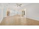 Open-concept living room with tile flooring and sliding doors to the covered patio at 604 Cheviot Ct, Apopka, FL 32712