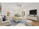 Open concept living room and dining space with sliding glass doors that lead to the outdoors at 604 Cheviot Ct, Apopka, FL 32712