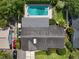 Overhead view showcasing the property's roof, backyard pool, and surrounding neighborhood at 676 Dunblane Dr, Winter Park, FL 32792
