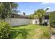 Fenced backyard featuring green grass and lush greenery at 676 Dunblane Dr, Winter Park, FL 32792