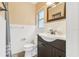 Cozy bathroom featuring a vanity with dark wood cabinets and a white sink and toilet at 676 Dunblane Dr, Winter Park, FL 32792