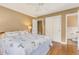 The primary bedroom includes hardwood floors and access to an ensuite bathroom and closet, providing a serene space at 676 Dunblane Dr, Winter Park, FL 32792