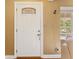 Bright white front door with decorative glass and classic hardware, offering a welcoming entry at 676 Dunblane Dr, Winter Park, FL 32792