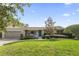 Charming single-story home with a well-manicured lawn and inviting curb appeal at 676 Dunblane Dr, Winter Park, FL 32792