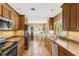 Updated kitchen with stainless steel appliances, granite countertops, and wood cabinets, providing style and functionality at 676 Dunblane Dr, Winter Park, FL 32792