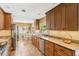 The kitchen boasts granite counters, wood cabinets, and stainless steel appliances with a breakfast nook area at 676 Dunblane Dr, Winter Park, FL 32792