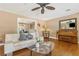 Well-appointed living room with fireplace, hardwood floors, and stylish furnishings at 676 Dunblane Dr, Winter Park, FL 32792