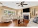 Cozy living room with fireplace, hardwood floors, and ample natural light at 676 Dunblane Dr, Winter Park, FL 32792