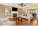 Comfortable living room features a fireplace, hardwood floors, and an open layout at 676 Dunblane Dr, Winter Park, FL 32792