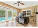 A home office with access to the backyard pool, offering a unique and convenient blend of work and relaxation at 676 Dunblane Dr, Winter Park, FL 32792