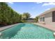 Refreshing pool with a private fence and manicured landscaping for a serene backyard oasis at 676 Dunblane Dr, Winter Park, FL 32792