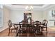 Formal dining room with wood floors, classic chandelier, and elegant wood dining set at 718 Glen Eagle Dr, Winter Springs, FL 32708