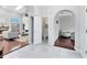 Welcoming foyer with views into the living room, half-bath, and sitting room at 718 Glen Eagle Dr, Winter Springs, FL 32708