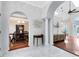 Inviting foyer with marble floors and arched doorways at 718 Glen Eagle Dr, Winter Springs, FL 32708