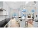Spacious kitchen with stainless steel appliances, granite countertops, an island and room for dining at 718 Glen Eagle Dr, Winter Springs, FL 32708