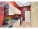Bright laundry room featuring a sink, overhead cabinets, shelving, and modern washer and dryer at 718 Glen Eagle Dr, Winter Springs, FL 32708