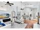 Open-concept living area with hardwood floors, fireplace, and views into the kitchen at 718 Glen Eagle Dr, Winter Springs, FL 32708