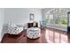 Bright living room with lots of natural light, beautiful wood floors, and comfortable seating at 718 Glen Eagle Dr, Winter Springs, FL 32708