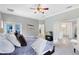 Main bedroom features hardwood floors, an attached bathroom, and access to a screened outdoor space at 718 Glen Eagle Dr, Winter Springs, FL 32708