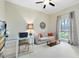 Office space with neutral colors, an extra sofa and natural light creates a productive atmosphere at 718 Glen Eagle Dr, Winter Springs, FL 32708