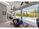 Covered patio overlooking the pool, features ample seating and lots of natural light and ceiling fans at 718 Glen Eagle Dr, Winter Springs, FL 32708