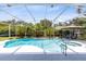 Screened in pool area featuring a pool, jacuzzi, lounging area, and well-manicured landscaping at 718 Glen Eagle Dr, Winter Springs, FL 32708