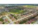 An aerial view shows proximity to green space and a lake, in a quiet neighborhood close to highways and shopping at 731 Arbor Pointe Ave, Minneola, FL 34715