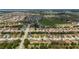 Birds eye view of a residential neighborhood with tree-lined streets and easy access to amenities at 731 Arbor Pointe Ave, Minneola, FL 34715