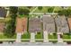 This aerial view showcases the street and home, with lovely lawns and trees, and wide driveways at 731 Arbor Pointe Ave, Minneola, FL 34715