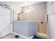 Modern bathroom featuring tiled shower with glass surround and neutral color scheme at 731 Arbor Pointe Ave, Minneola, FL 34715