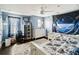 bedroom featuring a space themed decor and a ceiling fan at 731 Arbor Pointe Ave, Minneola, FL 34715