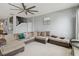 Open-concept living area with a large sofa and views of the stairway at 731 Arbor Pointe Ave, Minneola, FL 34715