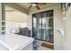 Cozy patio area with an outdoor kitchen, grill, and a sliding glass door at 731 Arbor Pointe Ave, Minneola, FL 34715