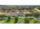 An inviting back patio area offers plenty of room for outdoor relaxation, with play area, and fenced backyard at 731 Arbor Pointe Ave, Minneola, FL 34715