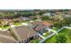 Beautiful backyard with green grass and shady area for a play area, surrounded by a white fence at 731 Arbor Pointe Ave, Minneola, FL 34715