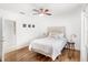 Bedroom with hardwood floors, neutral colors, and ample natural light at 7650 Whisper Way # 104, Reunion, FL 34747