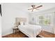 Bedroom features hardwood floors, natural light, and neutral colors at 7650 Whisper Way # 104, Reunion, FL 34747