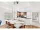 Bright dining area adjacent to the kitchen, illuminated by modern pendant lighting at 7650 Whisper Way # 104, Reunion, FL 34747