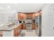 Modern kitchen with stainless steel appliances, granite countertops, and ample cabinet space at 7650 Whisper Way # 104, Reunion, FL 34747