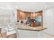 Contemporary kitchen featuring stainless steel appliances, a breakfast bar, and stylish design at 7650 Whisper Way # 104, Reunion, FL 34747