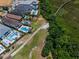 Aerial view of luxury homes with pools alongside a golf course and natural wetlands at 796 Desert Mountain Ct, Reunion, FL 34747