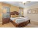 Comfortable bedroom featuring a wood bed frame, two nightstands and two windows with blinds at 796 Desert Mountain Ct, Reunion, FL 34747
