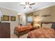 Comfortable bedroom featuring two beds, side tables, and an en-suite bathroom, ideal for guests or Gathering members at 796 Desert Mountain Ct, Reunion, FL 34747