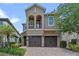 Charming two-story home with a two-car garage and well-maintained landscaping and a beautiful paver driveway at 796 Desert Mountain Ct, Reunion, FL 34747