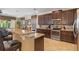 Modern kitchen featuring granite countertops, stainless steel appliances, custom cabinetry, and bar seating at 796 Desert Mountain Ct, Reunion, FL 34747