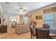 Spacious living room showcasing neutral furniture, carpet floors, and plenty of natural light at 796 Desert Mountain Ct, Reunion, FL 34747