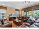 Comfortable living room with plush sofas, a coffee table, and views of the outdoor pool area at 796 Desert Mountain Ct, Reunion, FL 34747